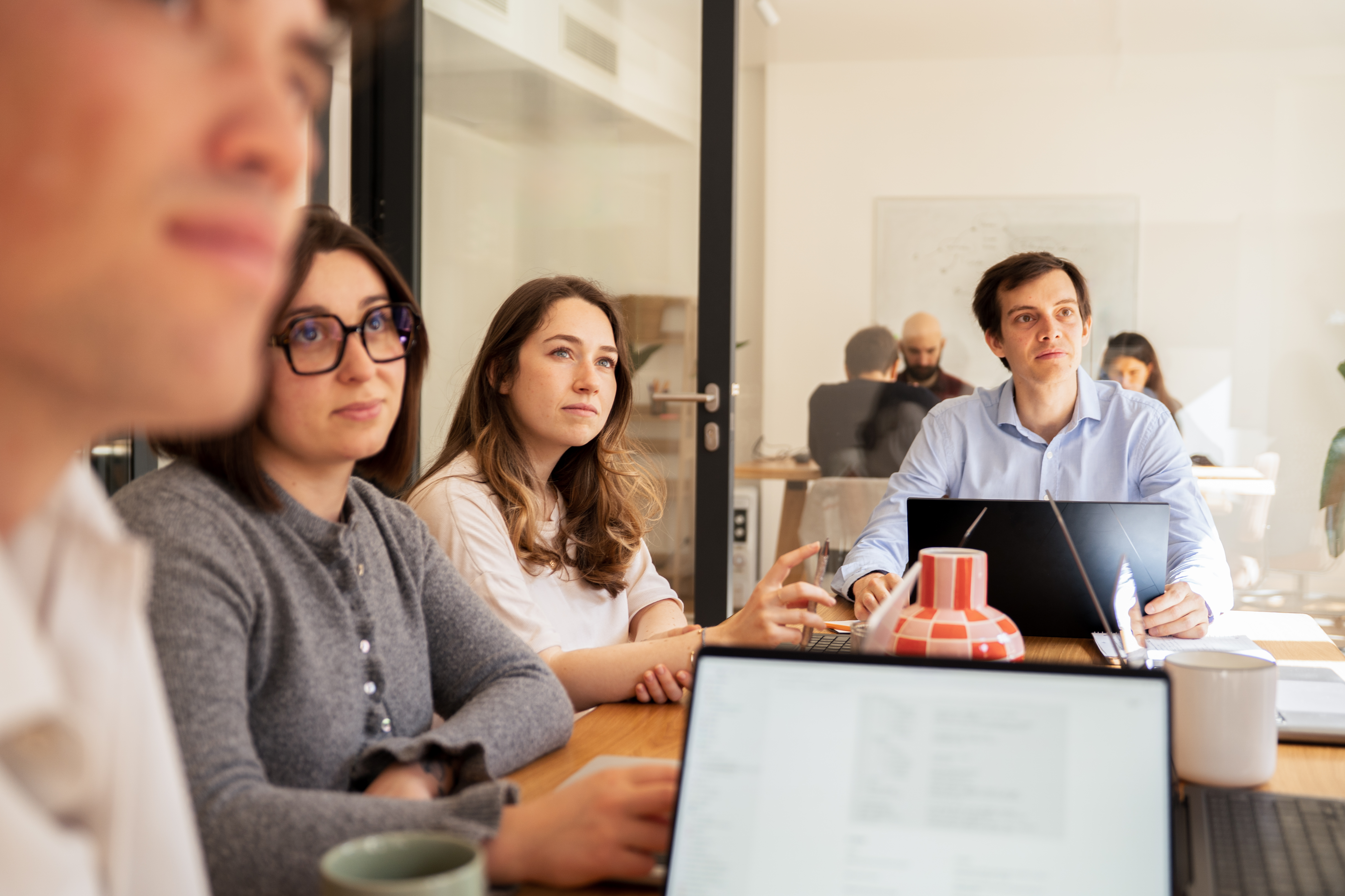 Galadrim team listening closely during a working session