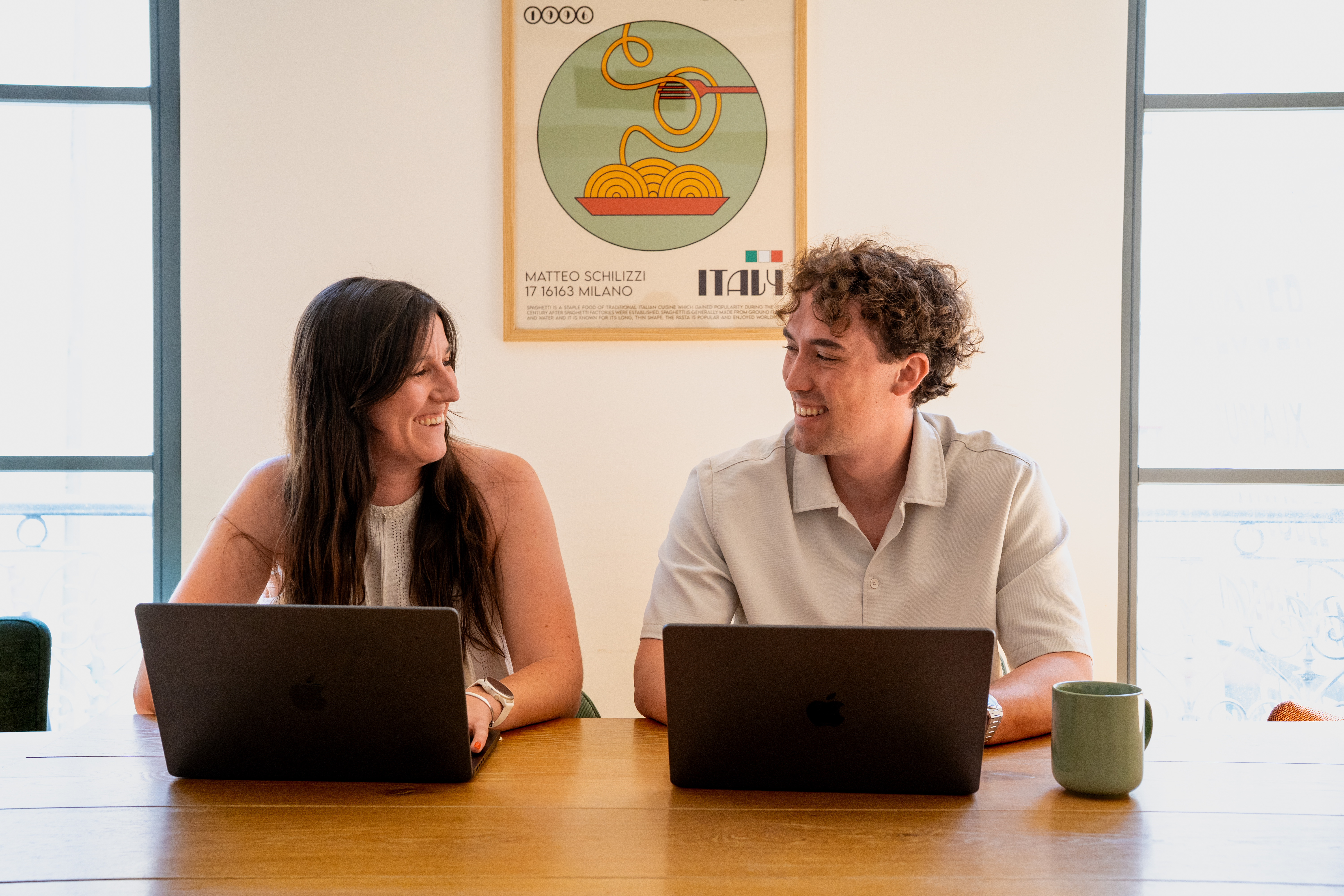 Two Galadrimers talking in front of their computers