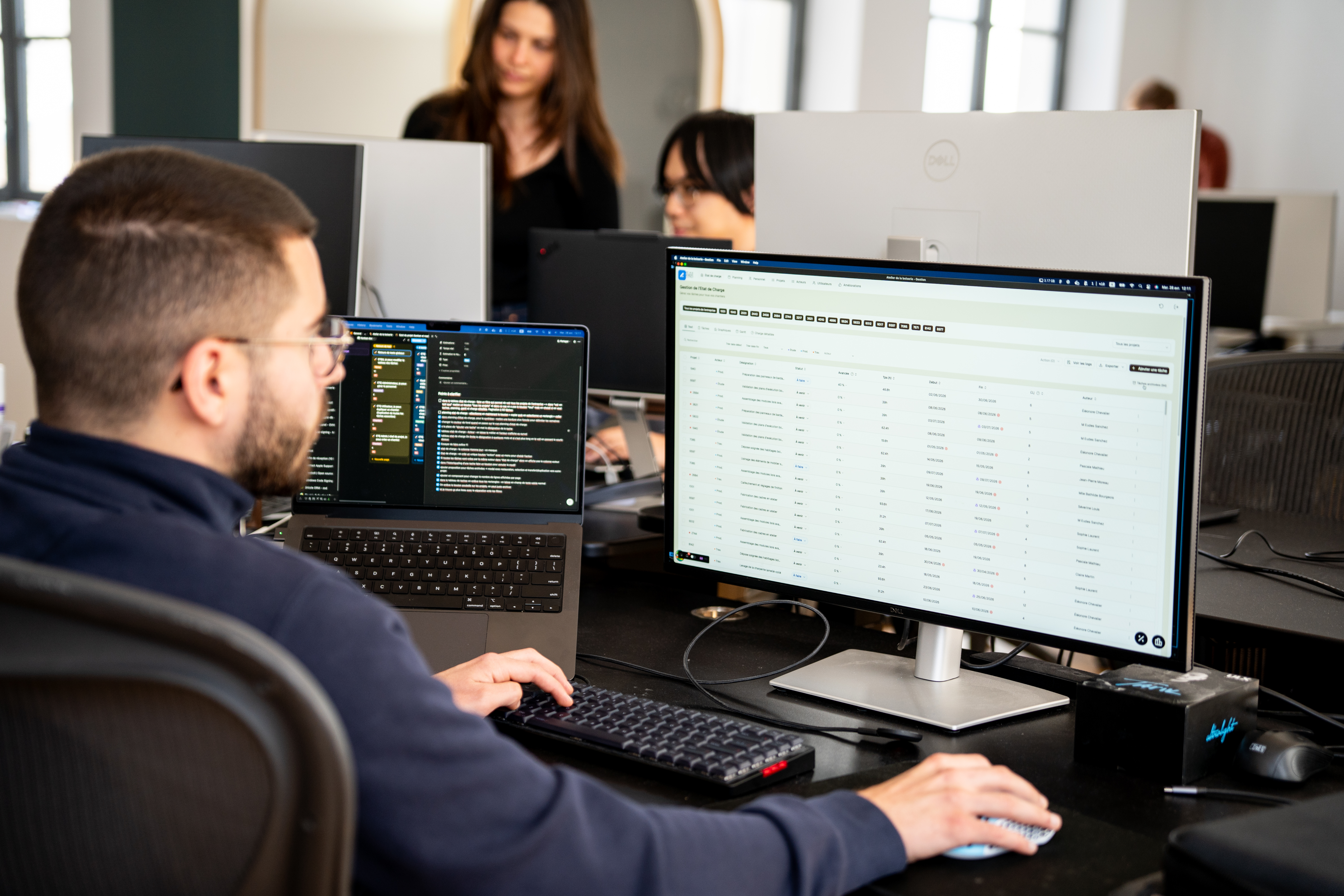 A Galadrim developer working on business software displayed full-width on their screen