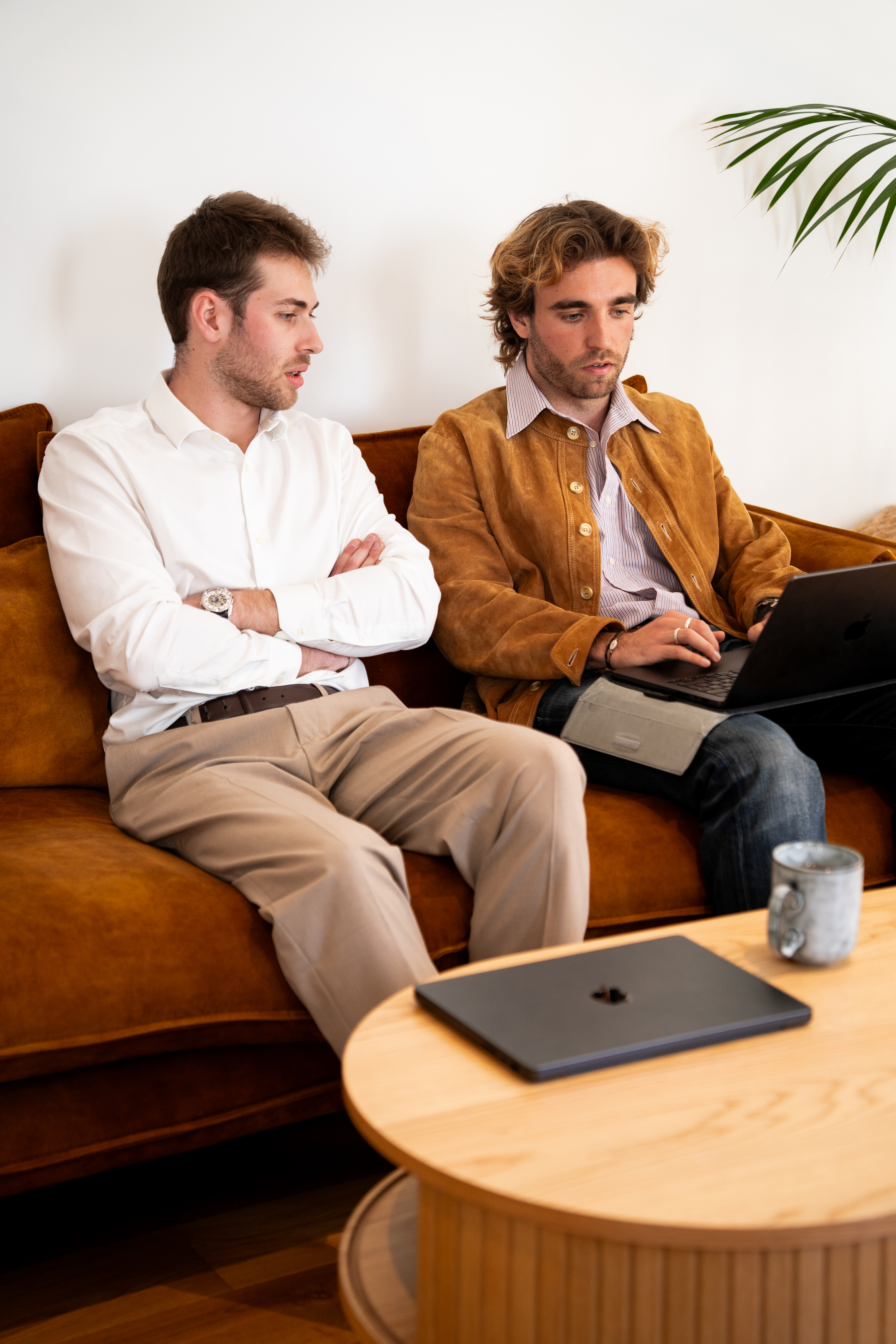 Two Galadrim consultants reviewing work on a laptop