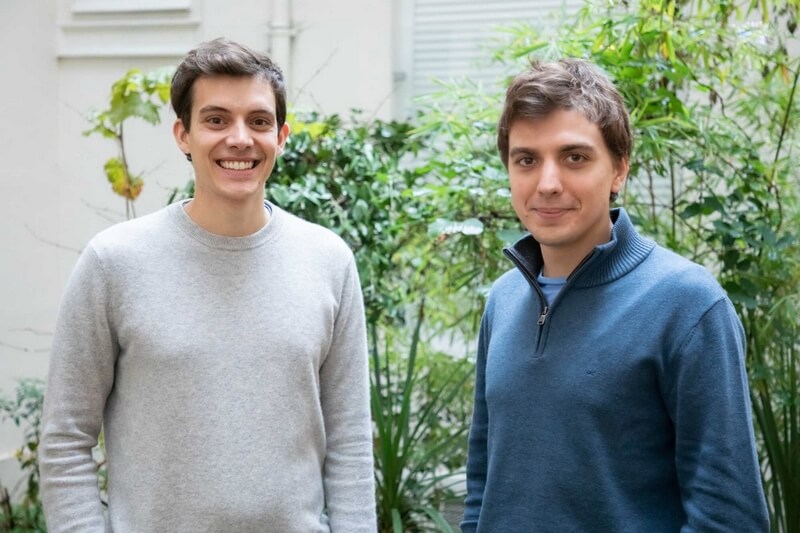 Jean Ashton and Arnaud Albalat, Galadrim's two founders, standing in front of a green wall.