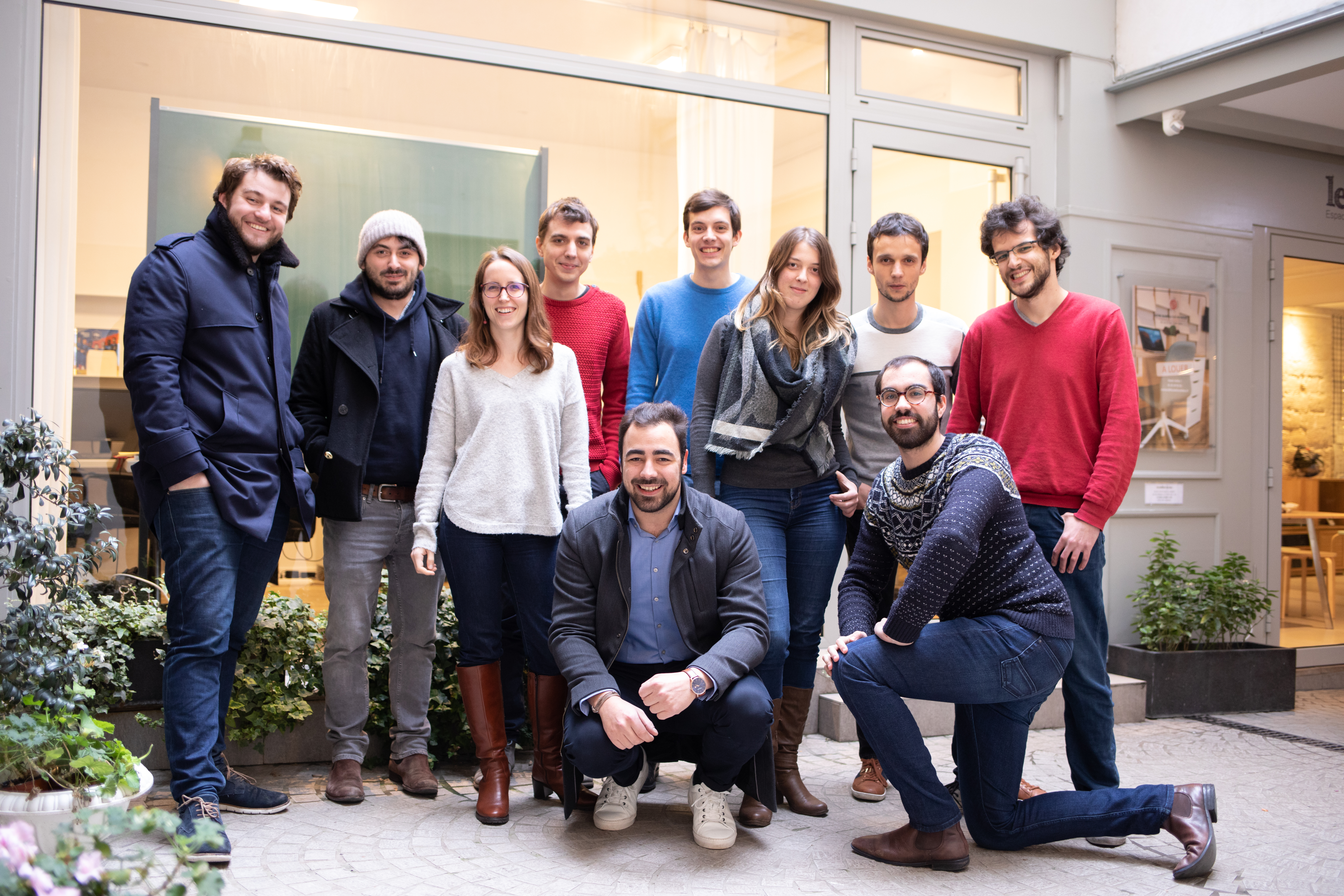 The full Galadrim team in front of a shopfront, in 2018.